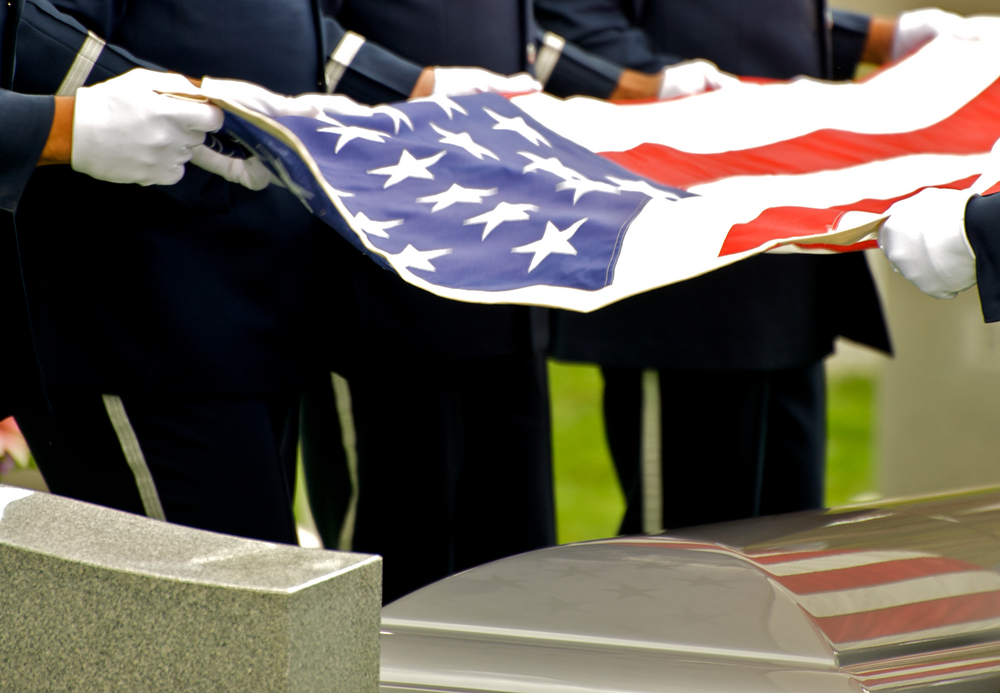 American flag placed over casket